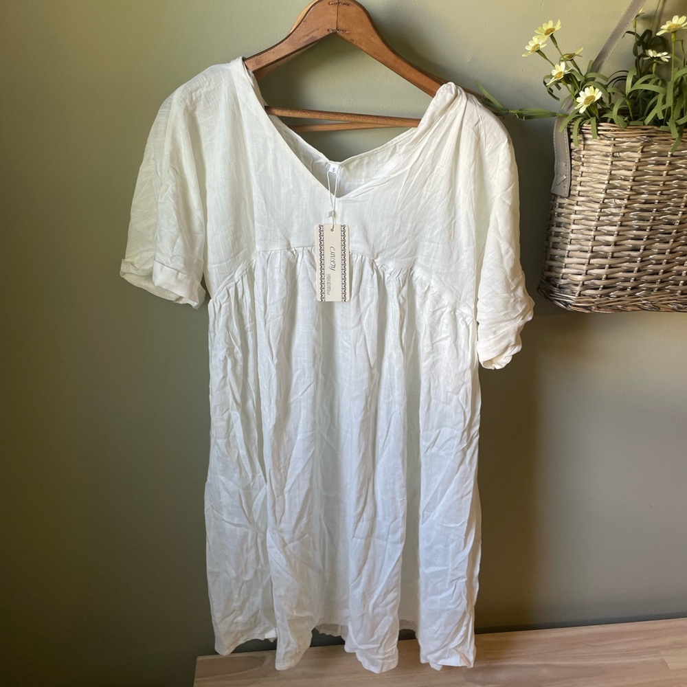 Never worn, off white mini dress! Perfect condition.